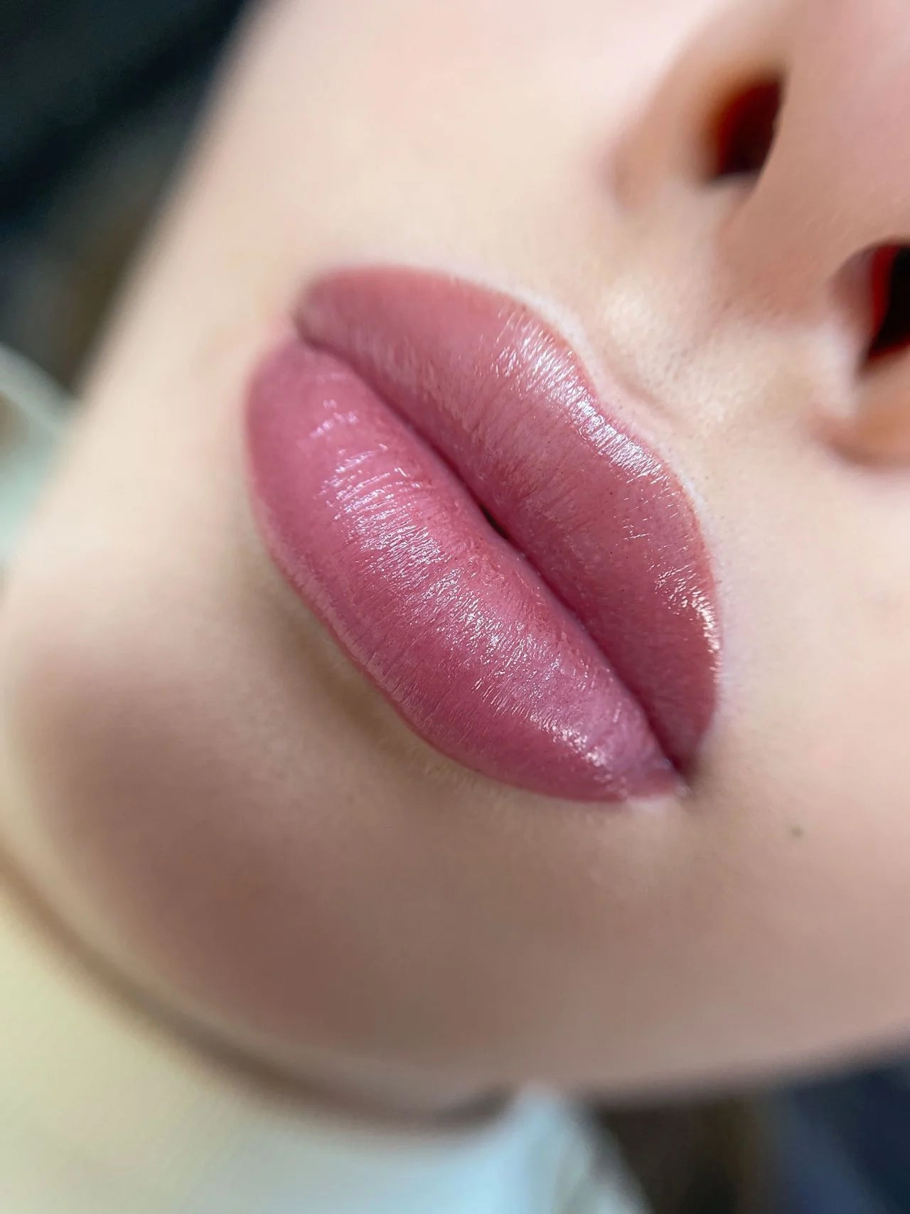 Close-up of a person's lips with a blurred background