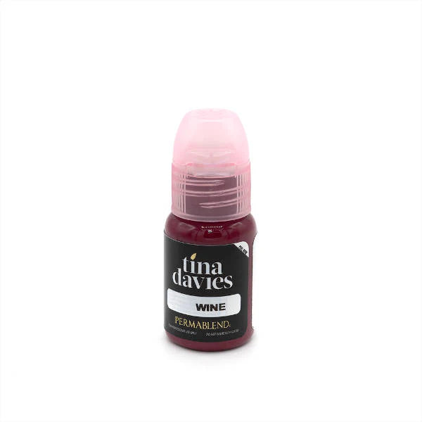 Bottle of Tina Davies paint with pink cap on a white background