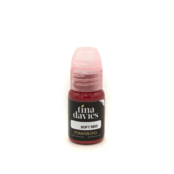Bottle of Tina Davies soft red paint on a white background