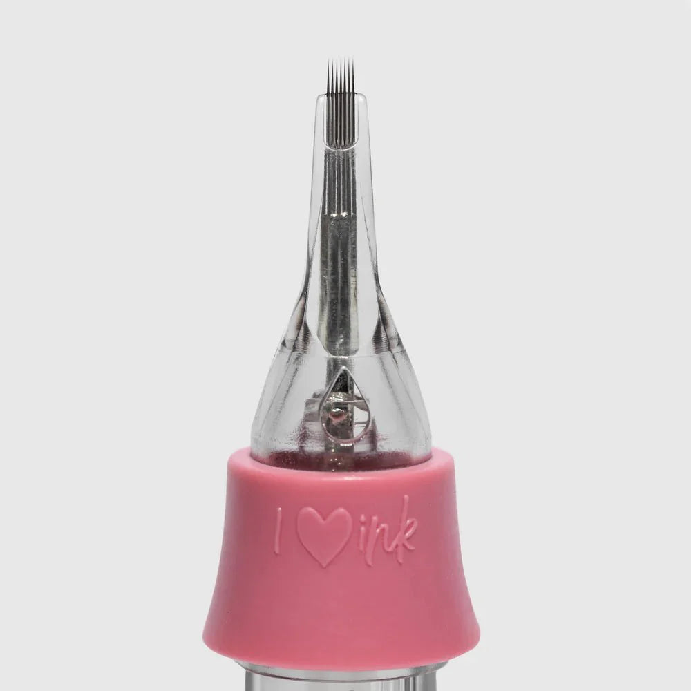 Pink tattoo cartridge with clear needle on a light gray background